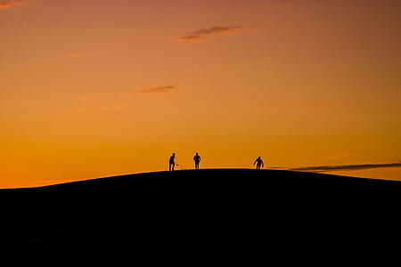 Silhouette of 3 People in Hill during Sunset thumbnail