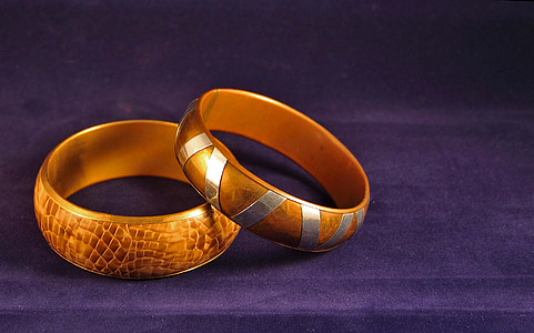 two gold-colored rings thumbnail