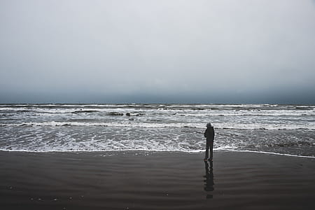 Person Standing Near Sea thumbnail