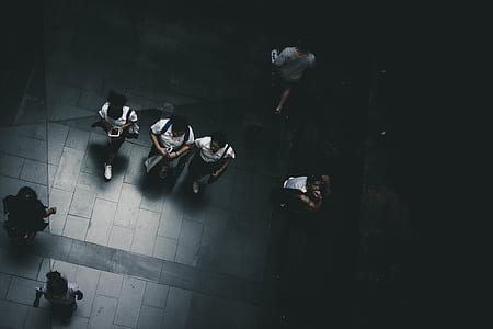 aerial photography of three women walking on road thumbnail