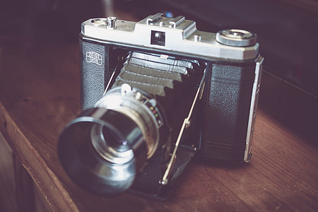 vintage black and silver DSLR camera thumbnail