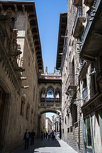 brown concrete arch under blue sky thumbnail