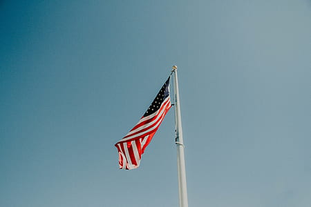 U.S.A. flag on white flagpole thumbnail