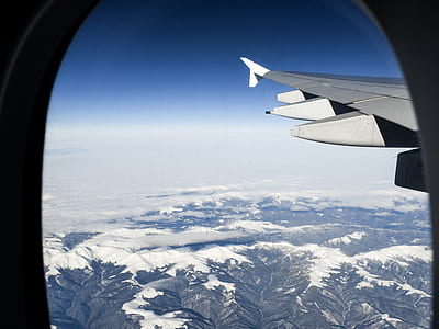 airplane above mountain at daytime thumbnail