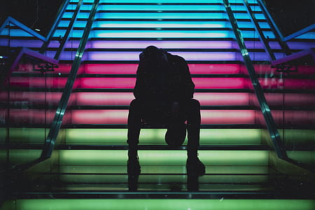 silhouette of man on multicolored staircase thumbnail