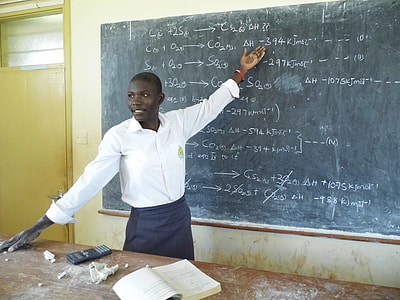 man wearing white dress shirt holding chalkboard thumbnail