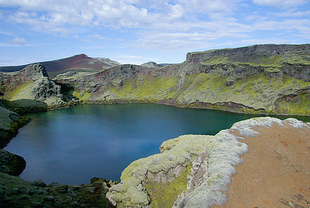 body of water between mountains thumbnail