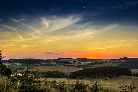 panoramic view of town under clear skies during sunset thumbnail