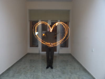 steel wool photography of man inside the hall thumbnail