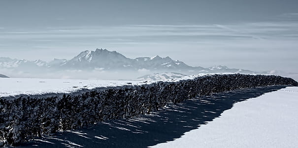 snow covered plains with water flowing in the center thumbnail