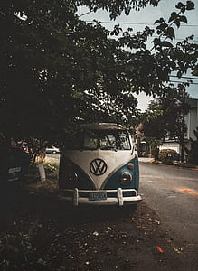 classic white and blue Volkswagen van thumbnail