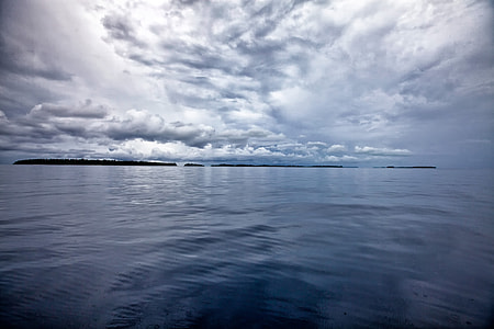 flat water under cloudy sky wallpaper thumbnail