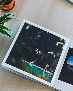 open photo album on wooden board thumbnail