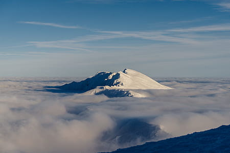 snow capped mountain under blue sky thumbnail