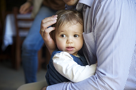closeup photo of person holding baby thumbnail