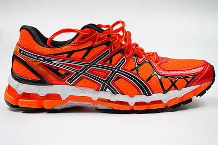 unpaired red and black ASICS running shoe with white background thumbnail