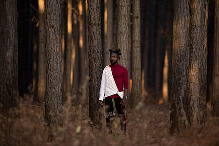 Man Standing in the Middle of Trees thumbnail