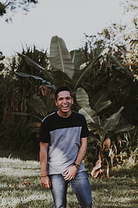 man standing near banana tree thumbnail