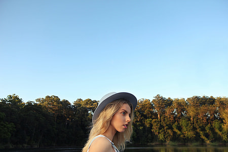 woman wearing sunhat facing right outdoors thumbnail