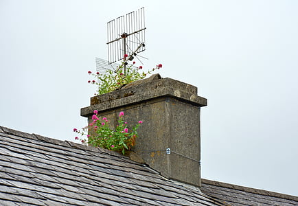 gray metal signal antenna on chimney thumbnail