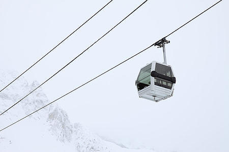 white cable car above alps thumbnail