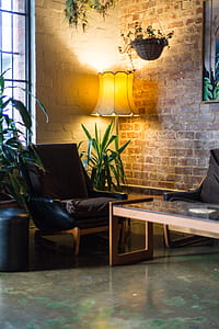 lighted floor lamp beside sofa chair thumbnail