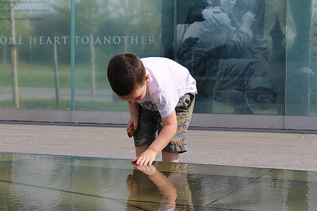 boy holding water thumbnail