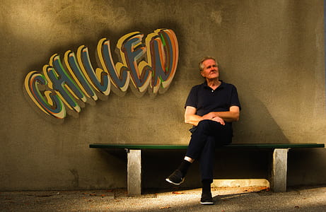 man sitting on bench thumbnail