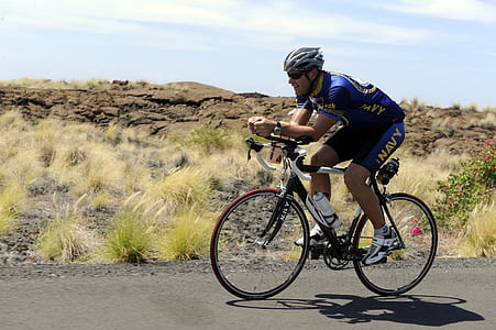 man riding on rode bike thumbnail