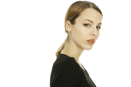 close up photo of a woman wearing black top thumbnail