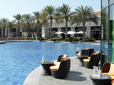 unoccupied chairs near swimming pool thumbnail