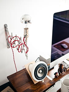 white speaker beside of monitor thumbnail