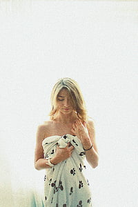woman wearing white and black paw print towel thumbnail