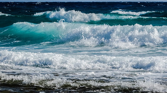 time-lapse photography of waves splashing on seashore thumbnail