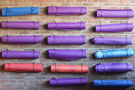 assorted-color rolled yoga mats thumbnail