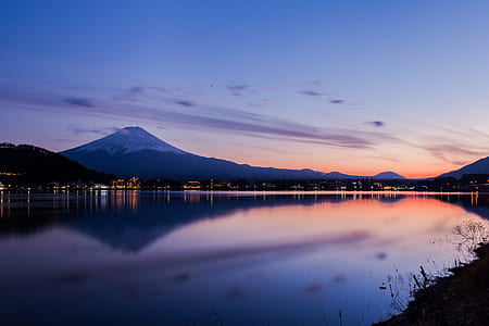 landscape photography of mountain near body of water thumbnail