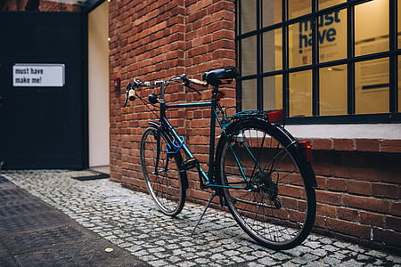 black city bike near window thumbnail