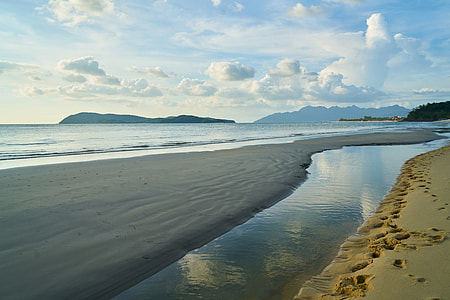 seashore under cloudy sky thumbnail