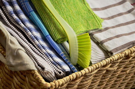 assorted-color textile on brown woven basket thumbnail