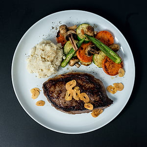 grilled meat with slice vegetables on white plate thumbnail