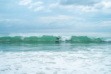person surfing on wave thumbnail