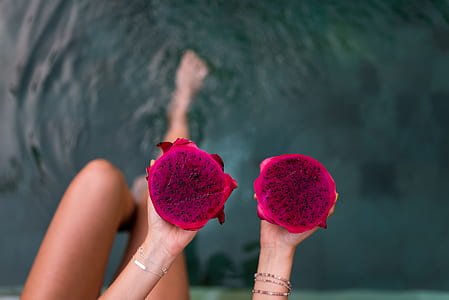 person holding dragon fruits thumbnail