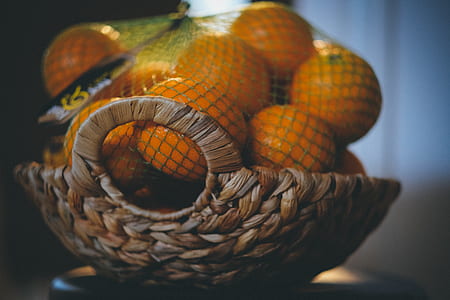 focus photography of basket of orange fruits thumbnail