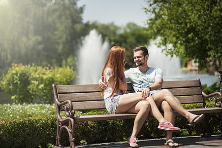 Man and Woman Sitting on a Bench thumbnail