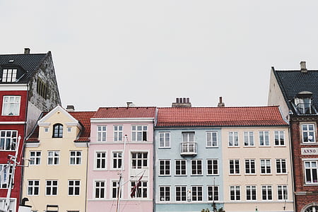 high-rise assorted-color concrete building during daytime thumbnail