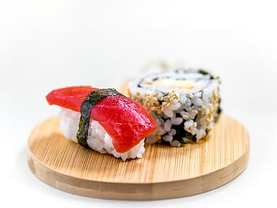 two sushi slices on top of wooden tray thumbnail
