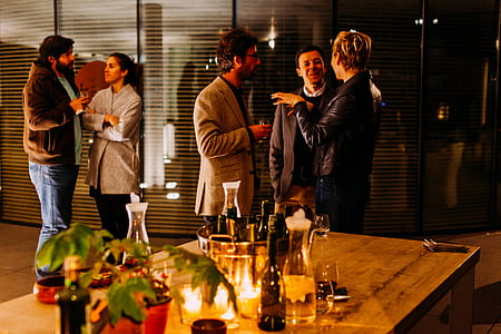 group of people interacting near table thumbnail
