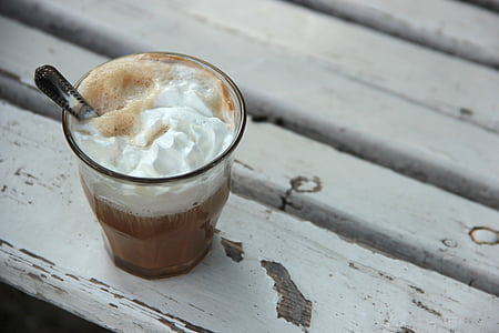 white cream in clear glass on white surface thumbnail