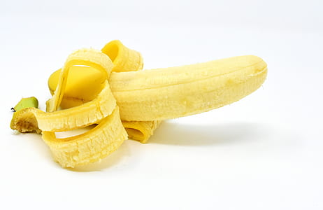 photo of peeled banana on white surface thumbnail