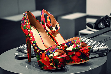 pair of red-green-and-black floral stiletto platform sandals on top of black table thumbnail